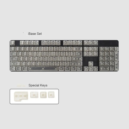 Set of 104 transparent blank PBT keycaps for mechanical keyboards in orange, white, blue, and black colours.