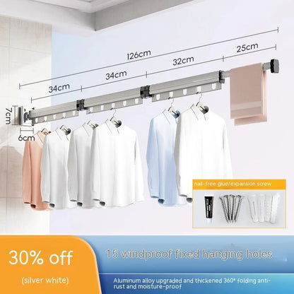 Aluminum retractable drying rack mounted on a window, extending outward for clothes drying