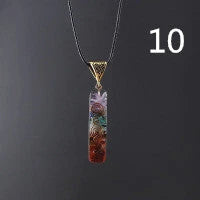 A stylish 7-chakra crystal pendant featuring a unique geometric design and natural stone patterns