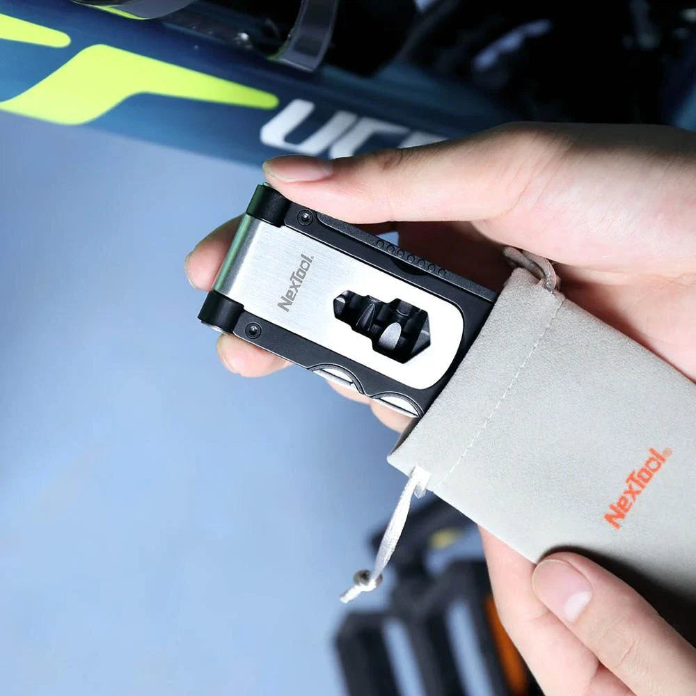 Compact, multi-function bicycle repair tool with wrench, tire spoon, and venting cap tools