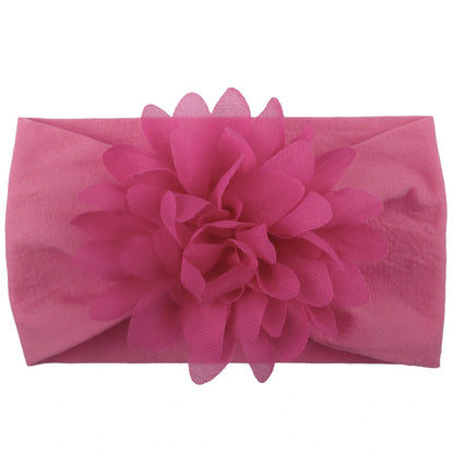 Adorable chiffon flower baby headband for your little princess, available in multiple colors.