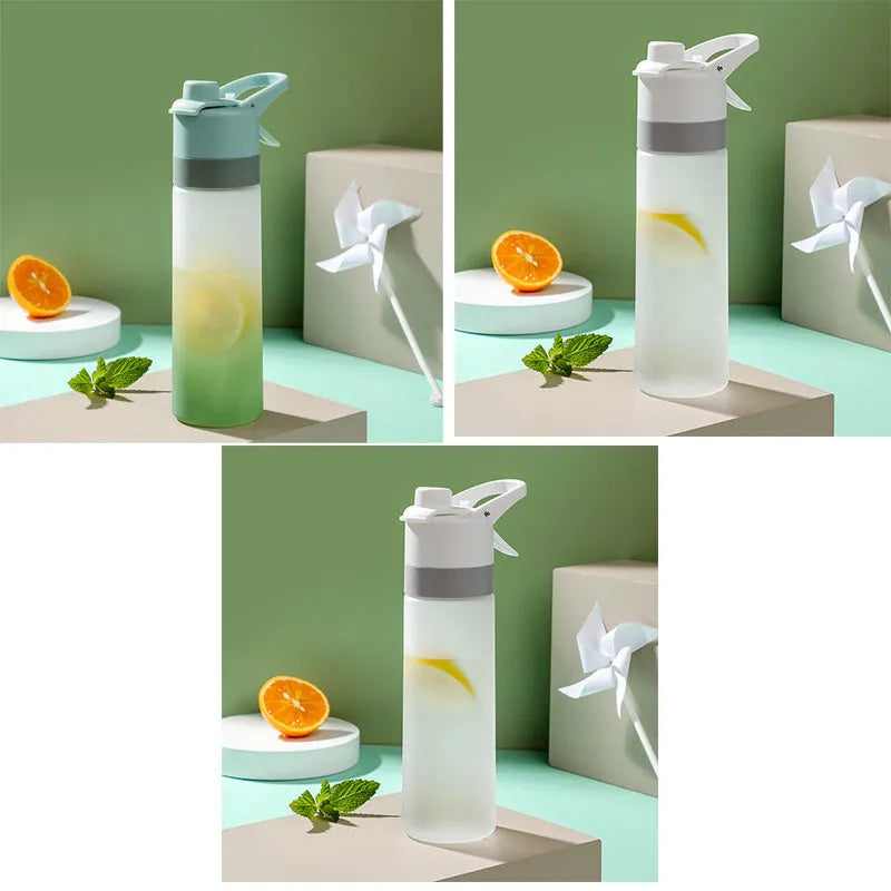 Large plastic spray water bottle with handle strap and leakproof lid in green colour.