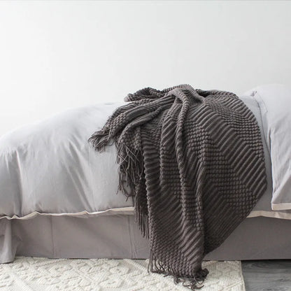Polyester small blanket shown in dark grey, measuring 127 by 170 centimetres.