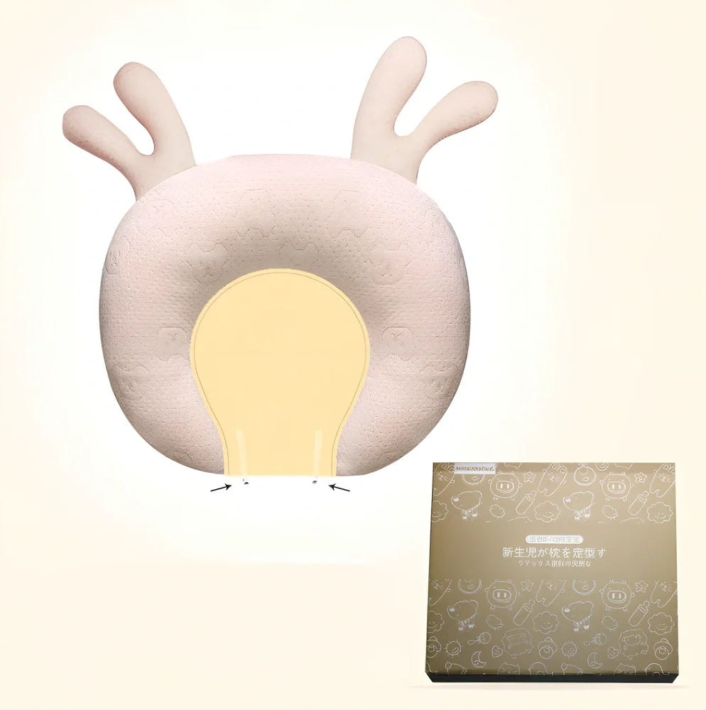 White baby pillow with latex core measuring 30x40cm for infant head support