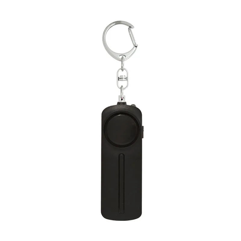 Compact pink self-defense alarm showing 86mm length with activation button and LED light