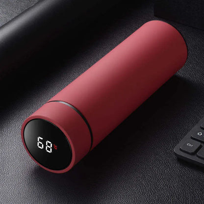 Stainless steel water bottle with double-wall vacuum insulation, shown in black, red, gold, and blue colour options.