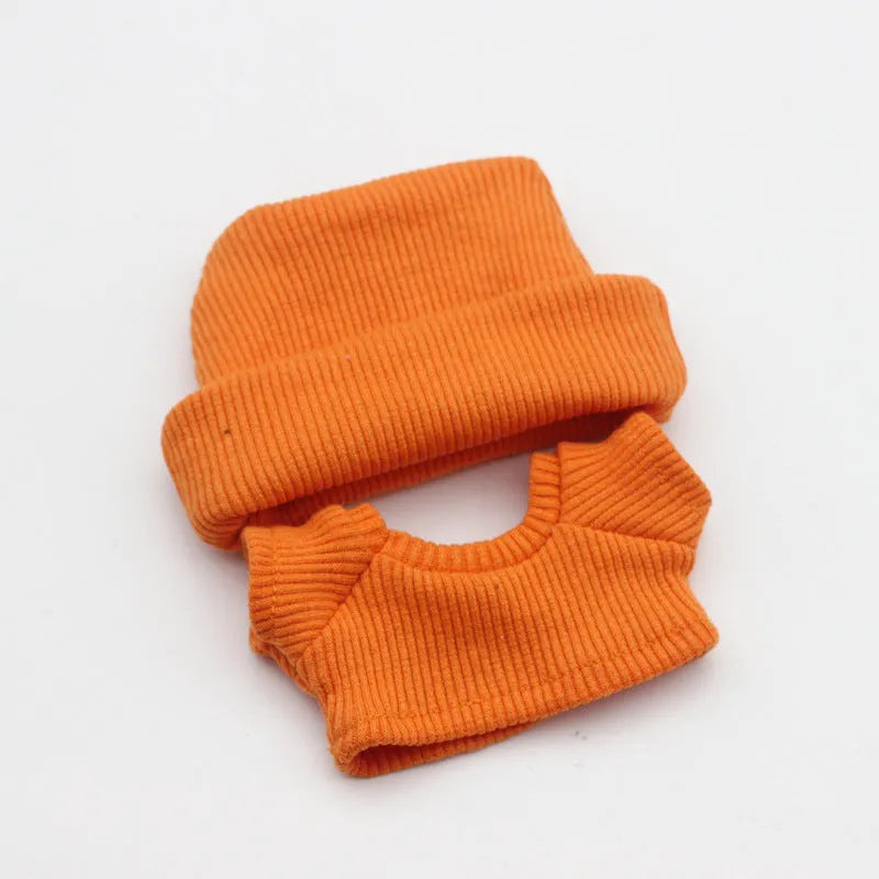 Doll clothes set with knitted flanging hat and T-shirt in multiple colours including pink, white, and stripes.