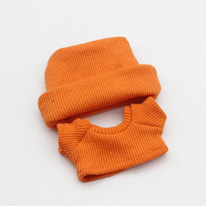 Doll clothes set with knitted flanging hat and T-shirt in multiple colours including pink, white, and stripes.
