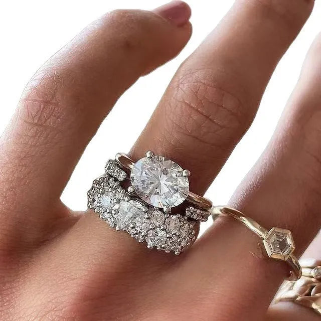 Women's white geometric alloy ring three-piece set with mosaic oval zircon detail, shown in sizes 6 to 10.