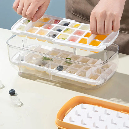 Quick release ice cube tray set with storage box and scoop, available in yellow, blue, and pink