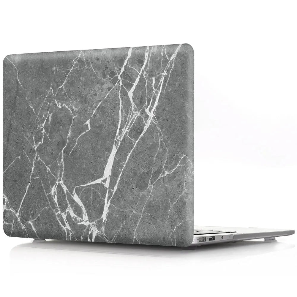 Plastic MacBook protective case in a marble pattern colour, shown next to a compatible Apple laptop.