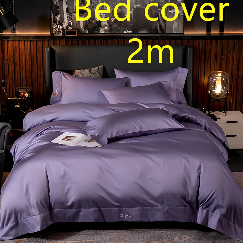 Four-piece quilted cotton bed set in royal blue, showing 200x230 cm cover and 48x74 cm pillowcases for 1.5m bed