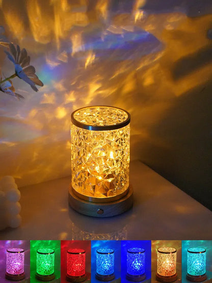 Rotating water ripple night light with acrylic construction and solid wood base measuring 9.5x14.5x10.5cm
