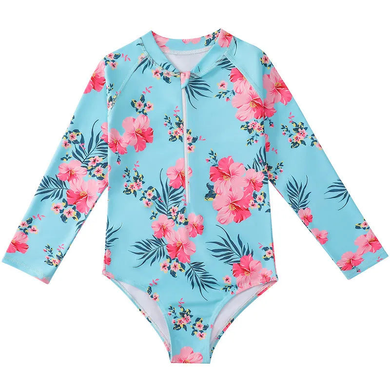 Girl's long-sleeve one-piece swimming suit in a briefs style on a hanger.