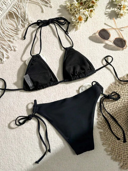 Black women's bikini set with 3D flower lace detailing and an adjustable drawstring waist.