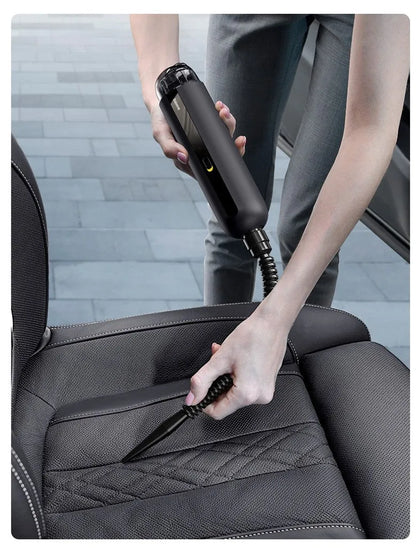 BASEUS handheld car vacuum cleaner in black with blowing hose attachment, showing compact size and dust bin