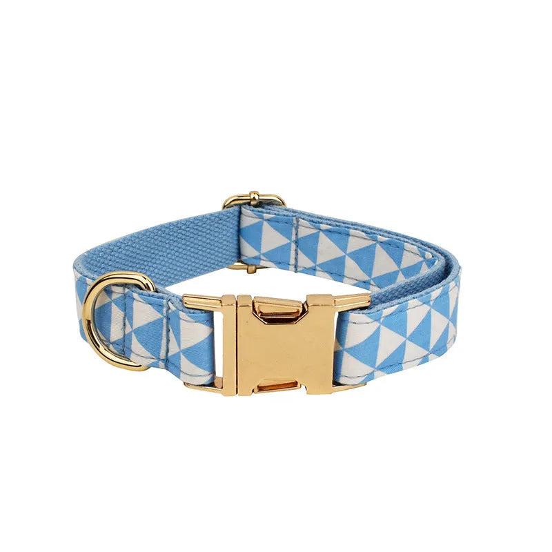 Pet dog collar, leash, bow and vest four-piece set in blue cloth fabric with triangular ring attachments and adjustable sizing across five sizes from XS to XL for canine walking and styling