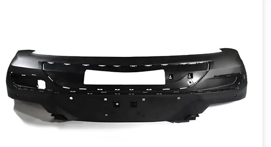 Unpainted black plastic car bumper replacement panel on a white background