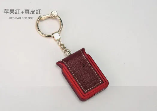 Bluetooth dual SIM adapter keychain in black leather with micro USB charging cable