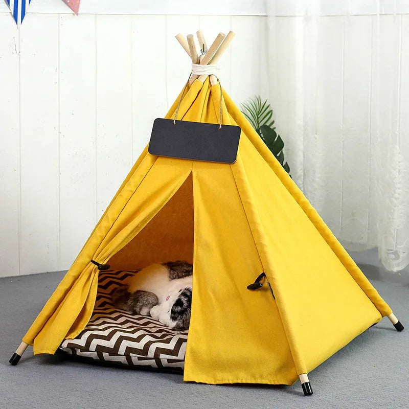 A striped pet teepee tent bed with a cushion inside, shown in a yellow colour option.