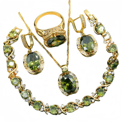 Olive green zircon jewellery suit set showing necklace with snake bone chain, matching earrings, and ring on a display.
