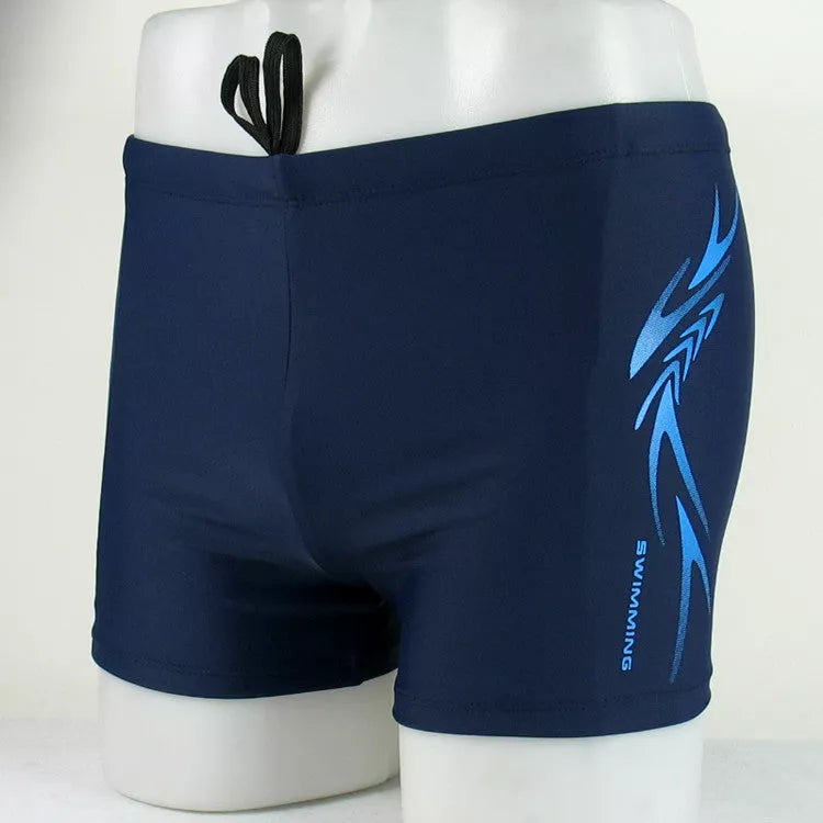 Men's boxer swimming trunks in dark blue and black, featuring quick-dry lining and stretch fabric