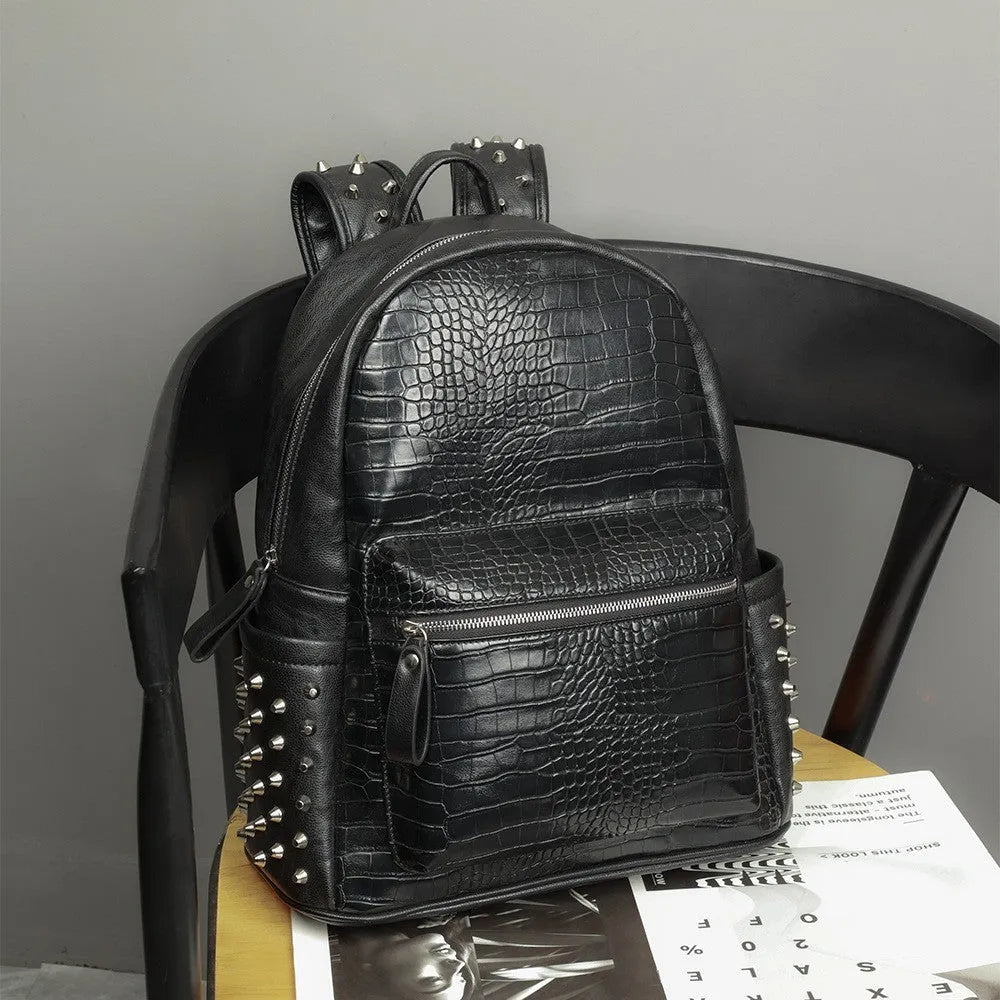 Black men's waterproof computer schoolbag with oil wax leather and rivet detailing.