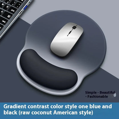 Silicone mouse mat with wristband in a gradient blue black colour pattern on a desk.