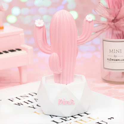 Cactus-shaped resin night light in gold finish measuring 15cm tall with warm LED glow