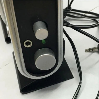 Black compact USB notebook mini speaker for laptop and computer audio enhancement.