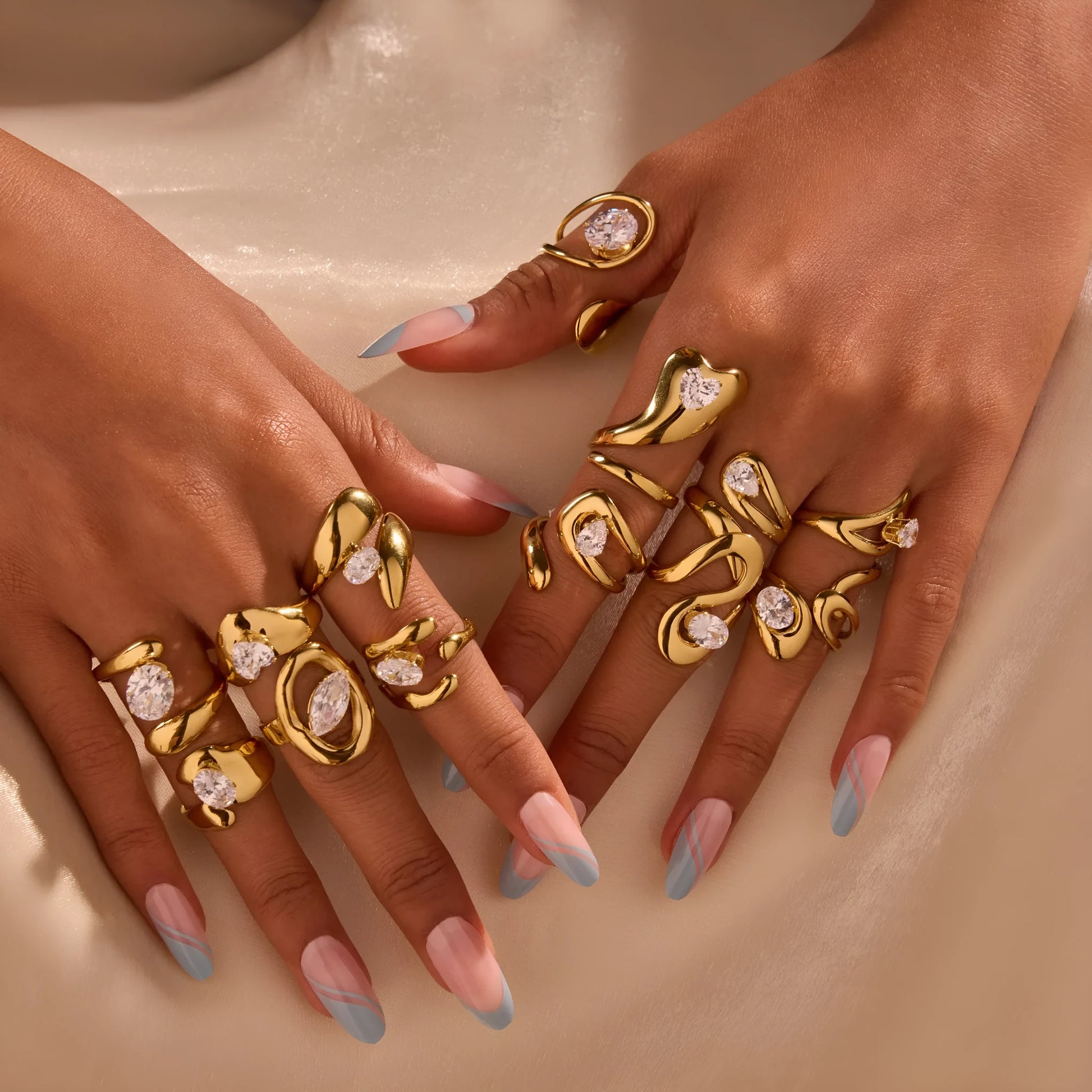 Geometric zircon ring showing round, oval and quadrangular design elements in stainless steel with electroplated finish