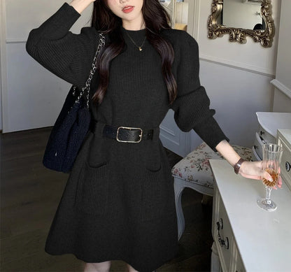 Women's long sleeve loose knitted dress in beige with black belt, showing high waist design and free size fit