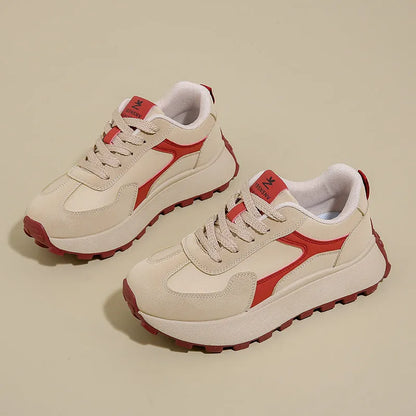 Women's solid colour low-top sports shoes with flat platform sole and lace-up front.