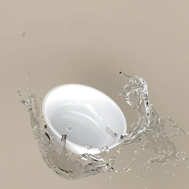 Green tilted stainless steel pet bowl with a 15-degree angle on a white background.
