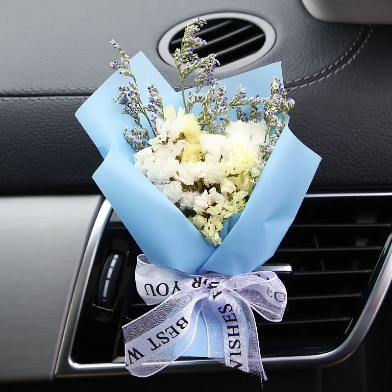 Mini dried flower bouquet mounted in car air vent for decorative aromatherapy
