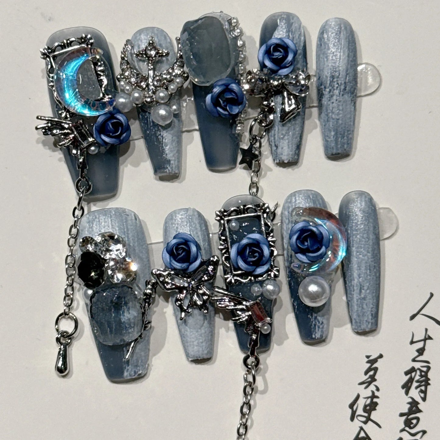 Heavy industry night blue plastic nail armour suit with ornate rose and tulip pattern, shown in size L.