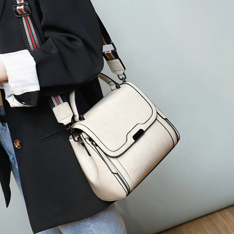 Women's genuine leather retro messenger bag in horizontal square shape with multiple internal compartments