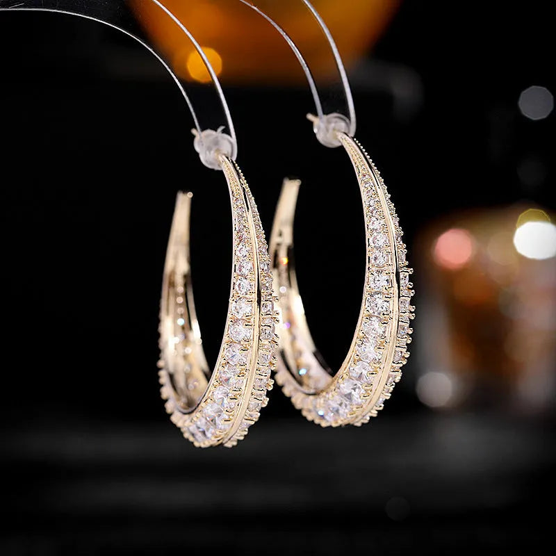 Geometric women's hoop earrings in gold white, purple, green, black, or silver white zirconium plating.