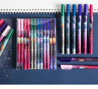 Twelve constellation ballpoint pens in a 12-piece plastic zodiac pen set with bright star designs.