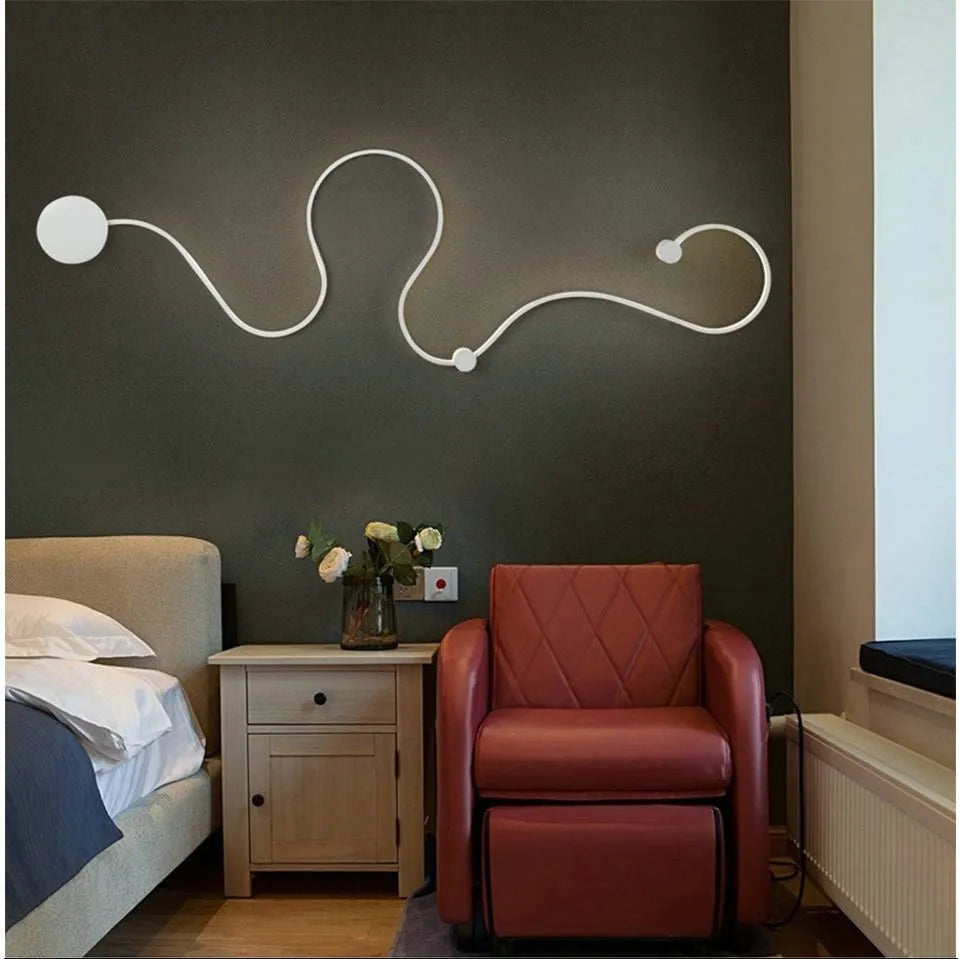 Modern black and white LED wall lamp with aluminium shade in four different sizes for bedside or corridor lighting