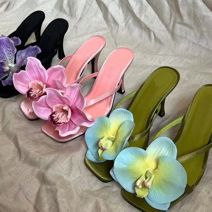 Pink women's flip-flop sandals with artificial Phalaenopsis orchid flower and square-toe design