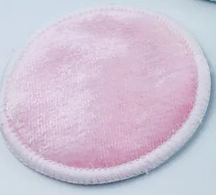 Set of water pink and light blue velvet makeup remover pads next to a cotton mesh storage bag.