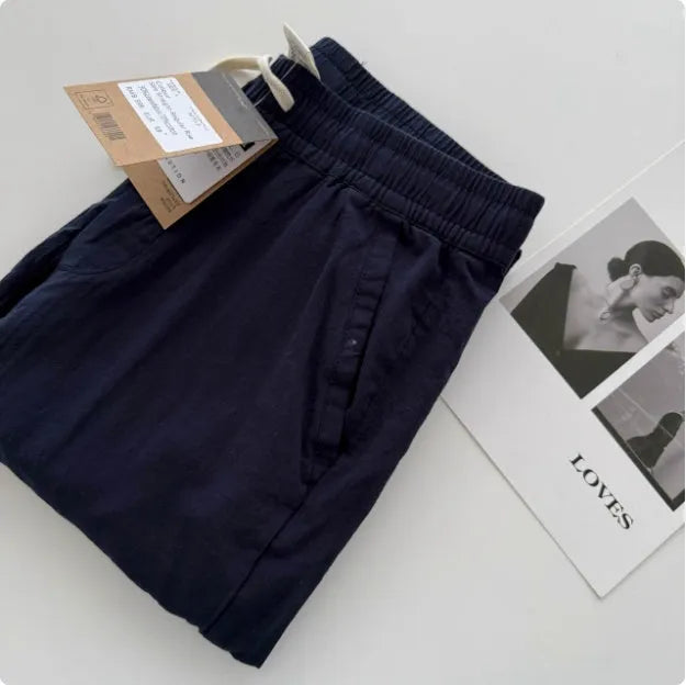 Men's loose straight casual pants with drawstring waist in navy blue colour, showing relaxed fit and straight leg design