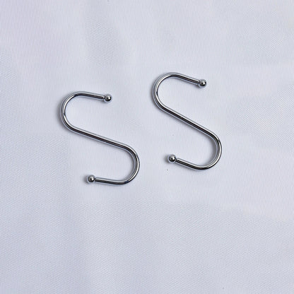 Hand-knitted cotton flowerpot net bag showing mesh pattern and hanging installation