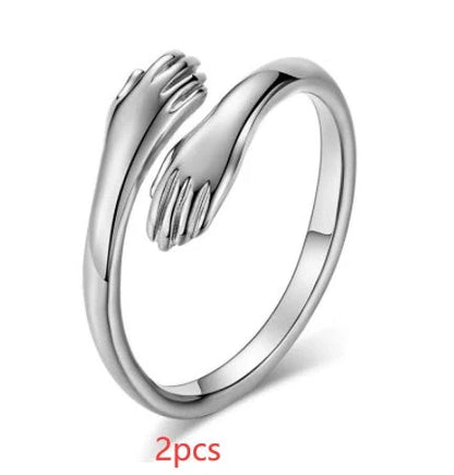 Adjustable Alloy Hands Hug Ring in gold and silver, featuring a unique geometry design