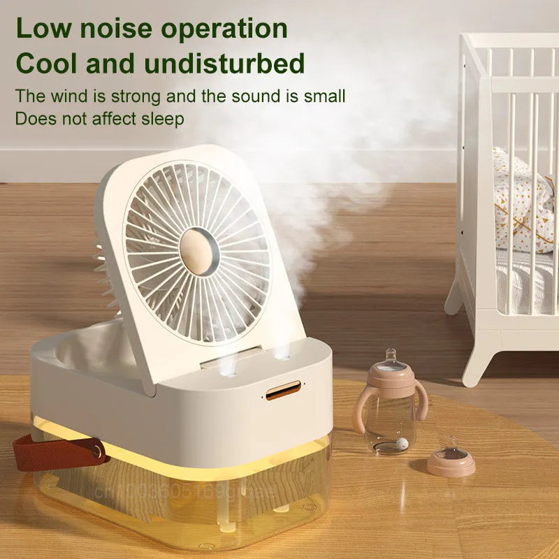 White or green USB desktop mist fan with large water tank, remote control, and dual spray nozzles on a desk.