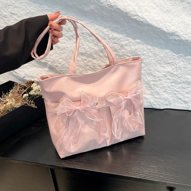 College style bow tote bag with large main compartment and internal zipper organiser in black colour