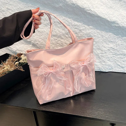 College style bow tote bag with large main compartment and internal zipper organiser in black colour