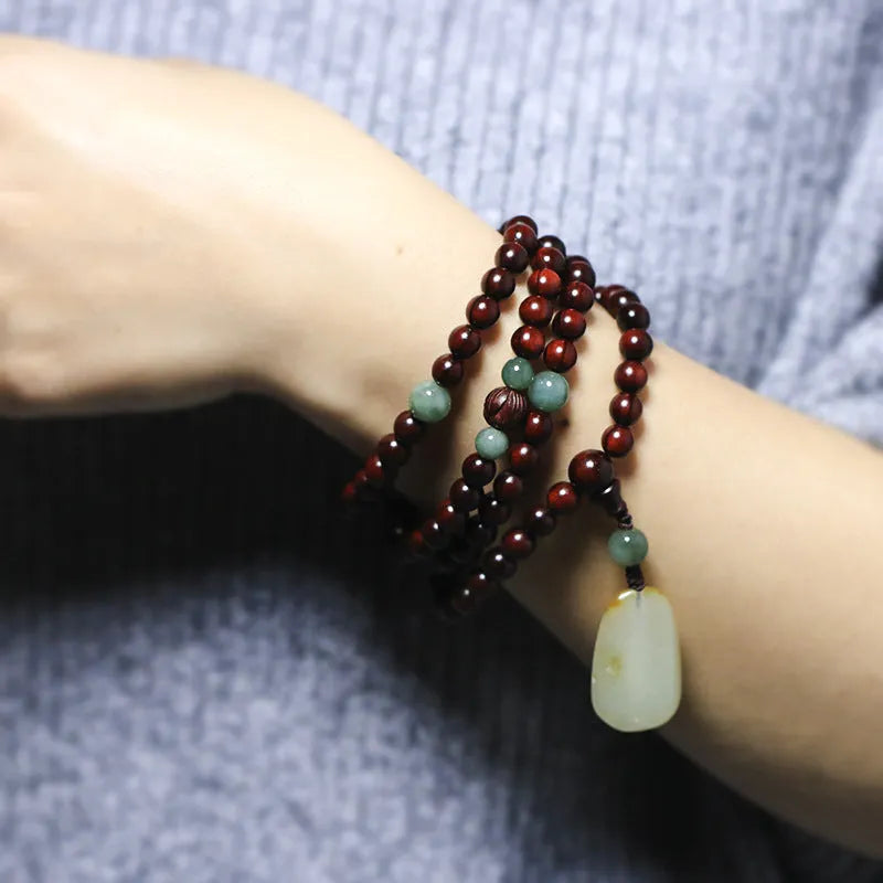 Rosewood bead bracelet featuring a hand-carved Pterocarpus Santalinus 108 6mm bead and Hotian jade pendant, an all-match unisex national style accessory available in Zambia rosewood or Indian rosewood at sizes of 6mm or 8mm.