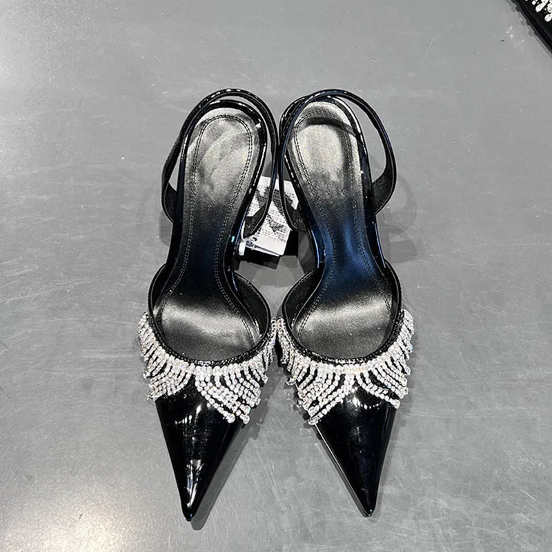 Black women's slingback high heel sandals with pointed toe, 10cm heel, and French tassel rhinestone decoration.